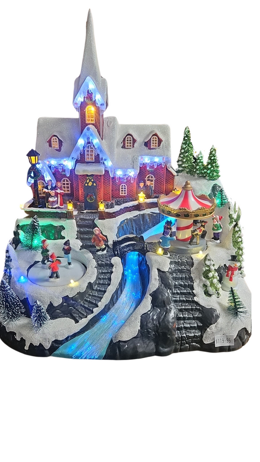 CHRISTMAS VILLAGE WITH TURNING CAROUSEL